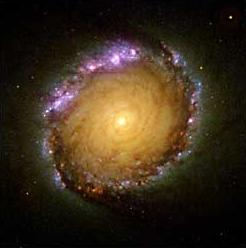 The colors of light shown in each individual filter in the previous figures are combined to form a multicolor image with bright violet in the outskirts of the spiral arms, yellow and green spiral arms, and a bright yellow central bulge.