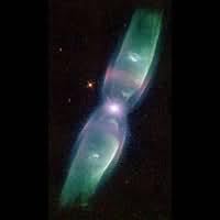 Nebula #8 has a bright white central star surrounded by pink and green plumes of gas. In this case the gas is mainly confined along a tube centered around the star, extending out in two directions and broadening in radius with distance from the star. The effect is somewhat like the two long wings of a raptor, spread out on either side of the star