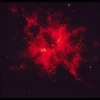 Nebula #9 is shown through a red light filter, and appears to have a patchy distribution of gas being thrown off from the central star in all directions.