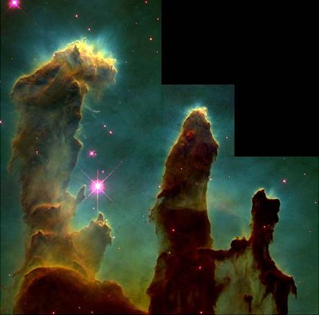 The Eagle Nebula, a region of space in which new stars are forming. Individual stars are surrounded by diffuse gas and dust.