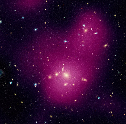 A large cluster containing thousands of individual galaxies, with a diffuse gas component surrounding them.
