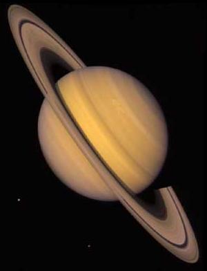 Saturn, with smooth horizontal bands of
clouds and a large, thin, bright ring system surrounding the planet at the equator.
