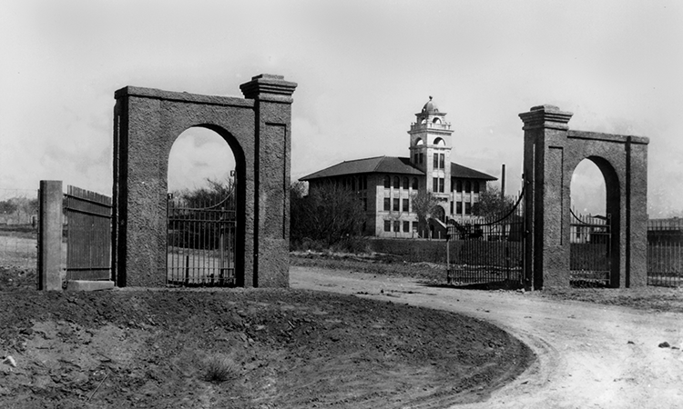 Goddard Hall as seen through the old gates of Miller field.